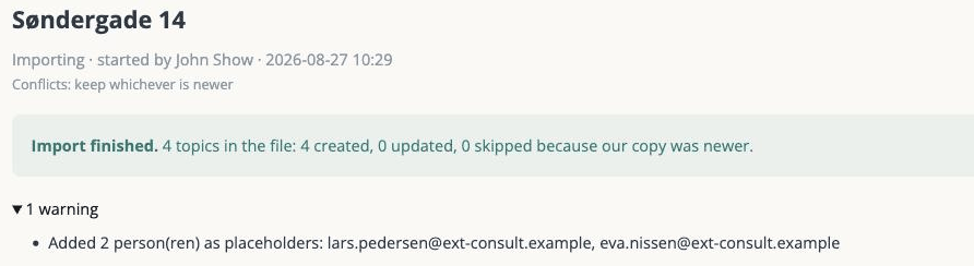 The import status page: what the import did, and a warning naming the placeholder people it added